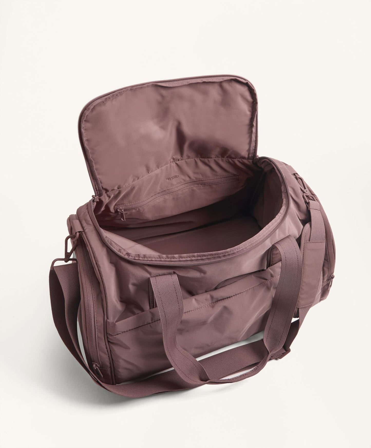 Technical bag with side pockets