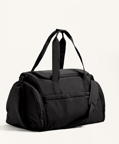 Technical bag with side pockets