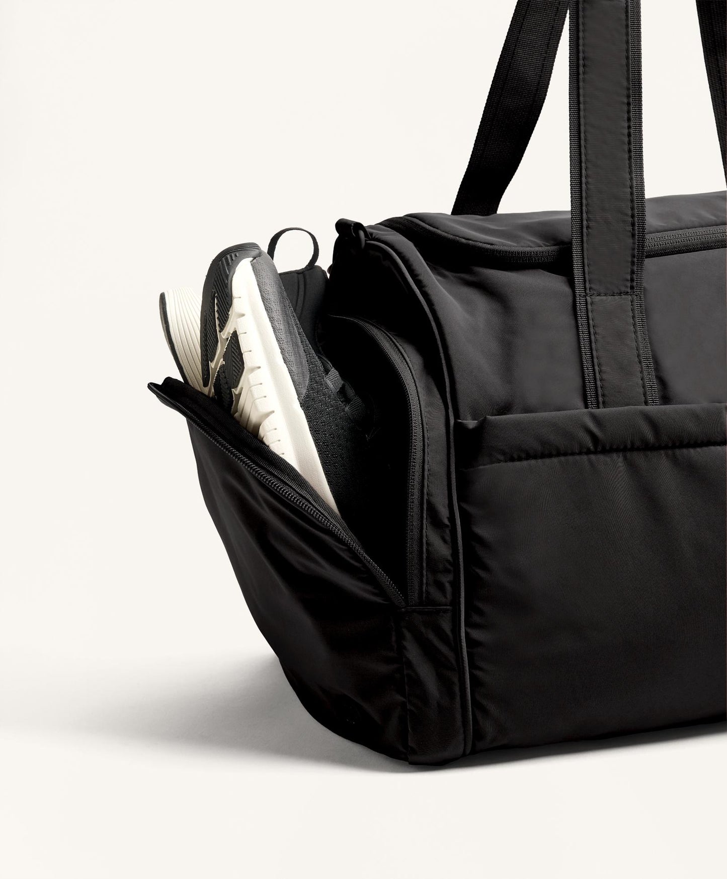 Technical bag with side pockets