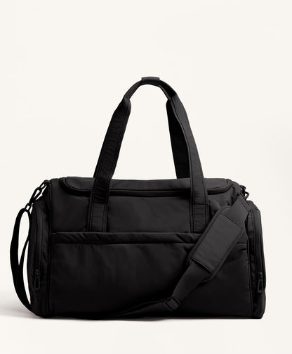 Technical bag with side pockets