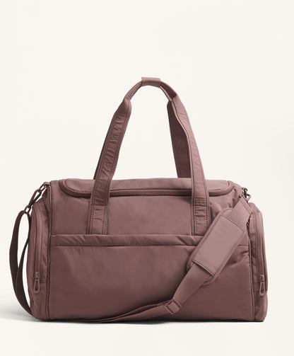 Technical bag with side pockets