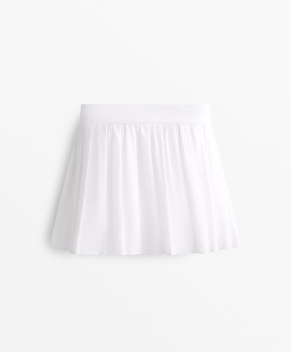 Pleated compressive skirt