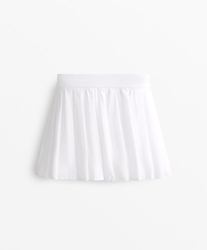Pleated compressive skirt
